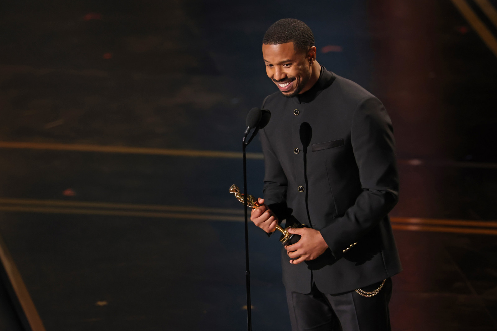 HOLLYWOOD, CALIFORNIA - MARCH 15: Michael B. Jordan accepts the Actor in a Leading Role award for "Sinners" onstage during the 98th Oscars at Dolby Theatre on March 15, 2026 in Hollywood, California. (Photo by Kevin Winter/Getty Images)