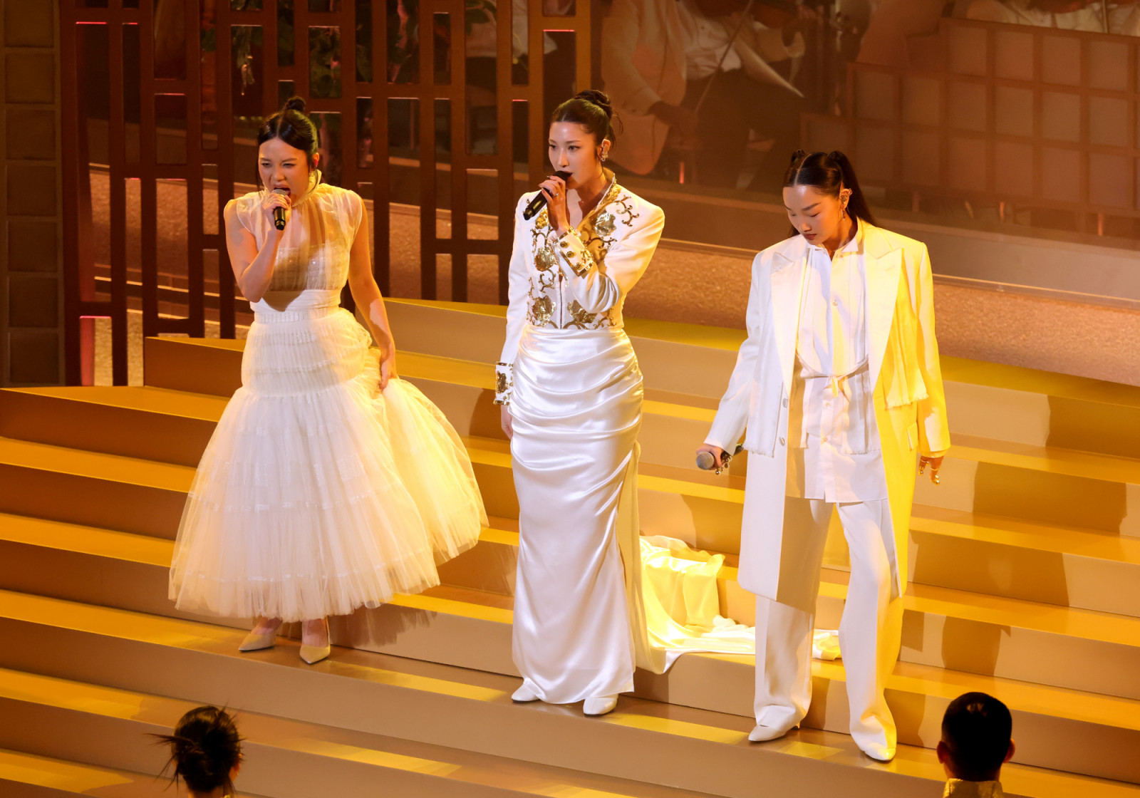 HOLLYWOOD, CALIFORNIA - MARCH 15: (L-R) Rei Ami, EJAE, and Audrey Nuna perform onstage during the 98th Oscars at Dolby Theatre on March 15, 2026 in Hollywood, California. (Photo by Kevin Winter/Getty Images)