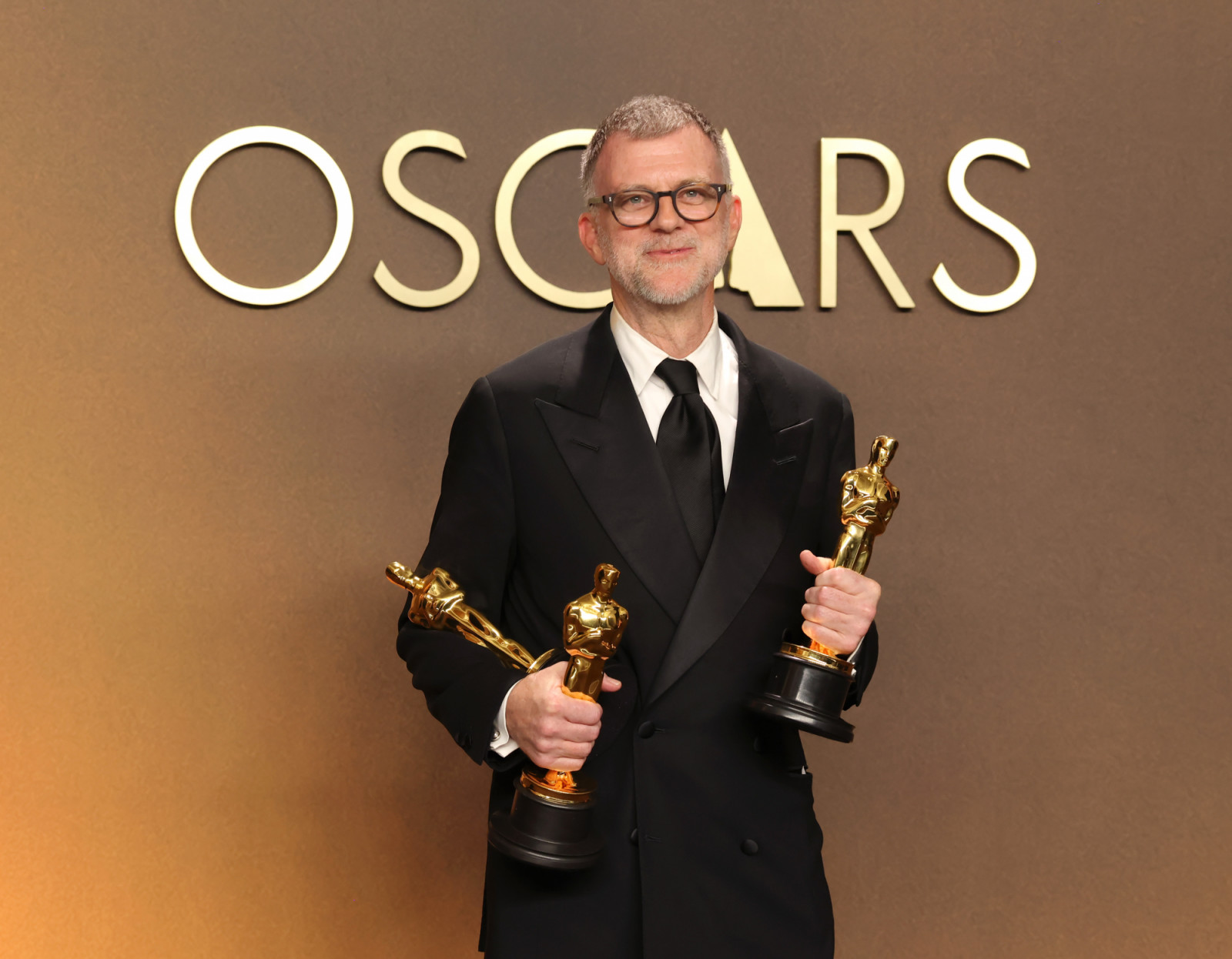HOLLYWOOD, CALIFORNIA - MARCH 15: Paul Thomas Anderson, winner of the Best Adapted Screenplay, Best Director and Best Picture Awards for “One Battle After Another”, poses in the press room during the 98th Oscars at Dolby Theatre on March 15, 2026 in Hollywood, California. (Photo by Mike Coppola/Getty Images)