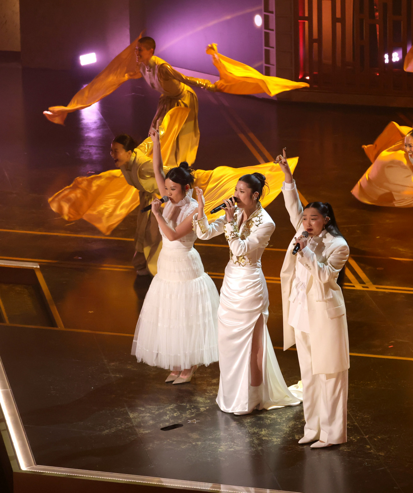 HOLLYWOOD, CALIFORNIA - MARCH 15: (L-R) Rei Ami, EJAE, and Audrey Nuna perform onstage during the 98th Oscars at Dolby Theatre on March 15, 2026 in Hollywood, California. (Photo by Kevin Winter/Getty Images)