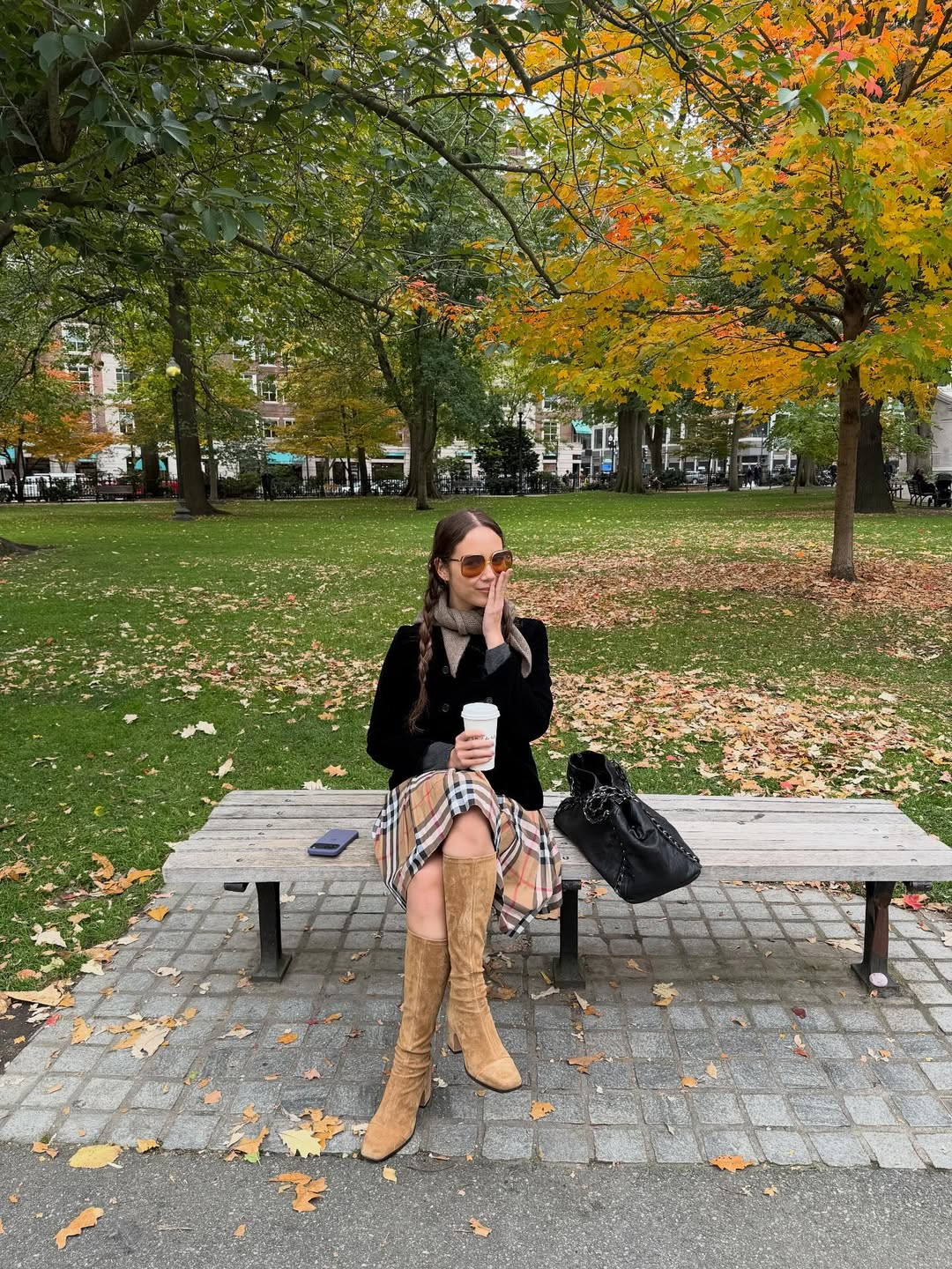 Soft knitwear layered over a midi skirt captures the nostalgic campus influences often seen in Laufey’s style (Photo: laufey/Instagram)