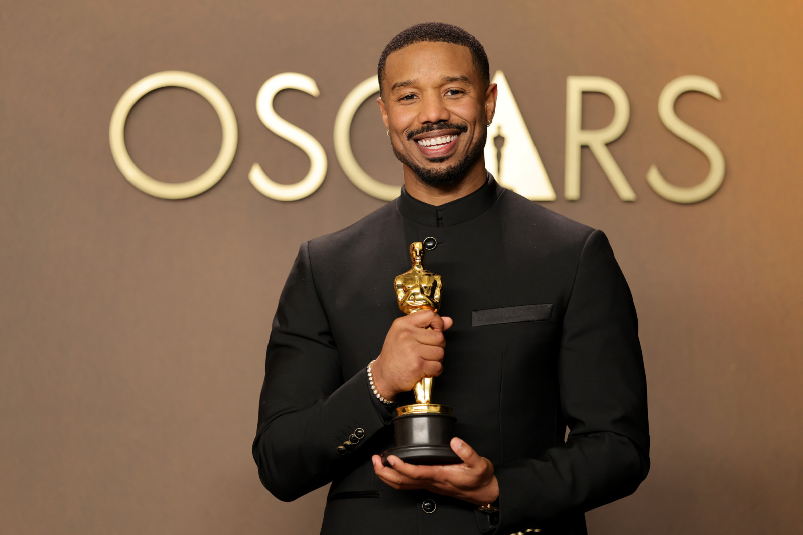 HOLLYWOOD, CALIFORNIA - MARCH 15: Michael B. Jordan, winner of the Best Actor Award for “Sinners”, poses in the press room during the 98th Oscars at Dolby Theatre on March 15, 2026 in Hollywood, California. (Photo by Brianna Bryson/Getty Images)