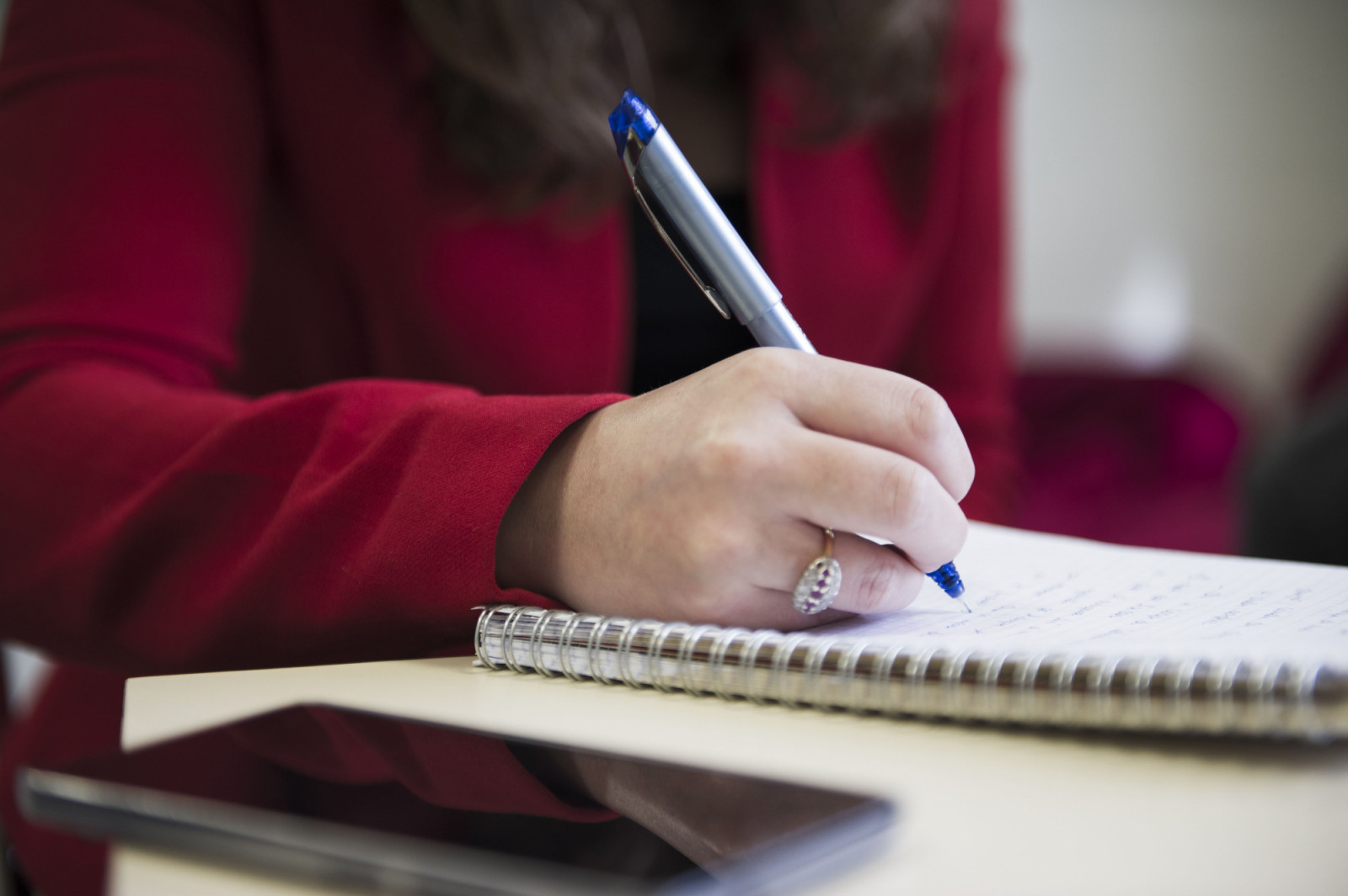 Note-taking on a pice of sheet with a pen during a business meeting (Photo by: Andia/Universal Images Group via Getty Images)