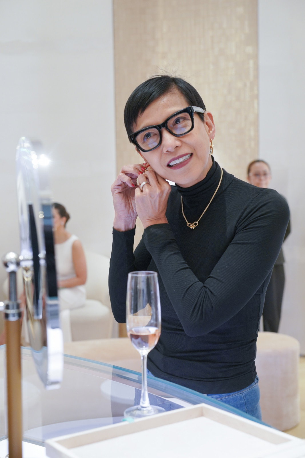 Felicia Atienza tries on Tiffany & Co. pieces; personal style meets iconic design.