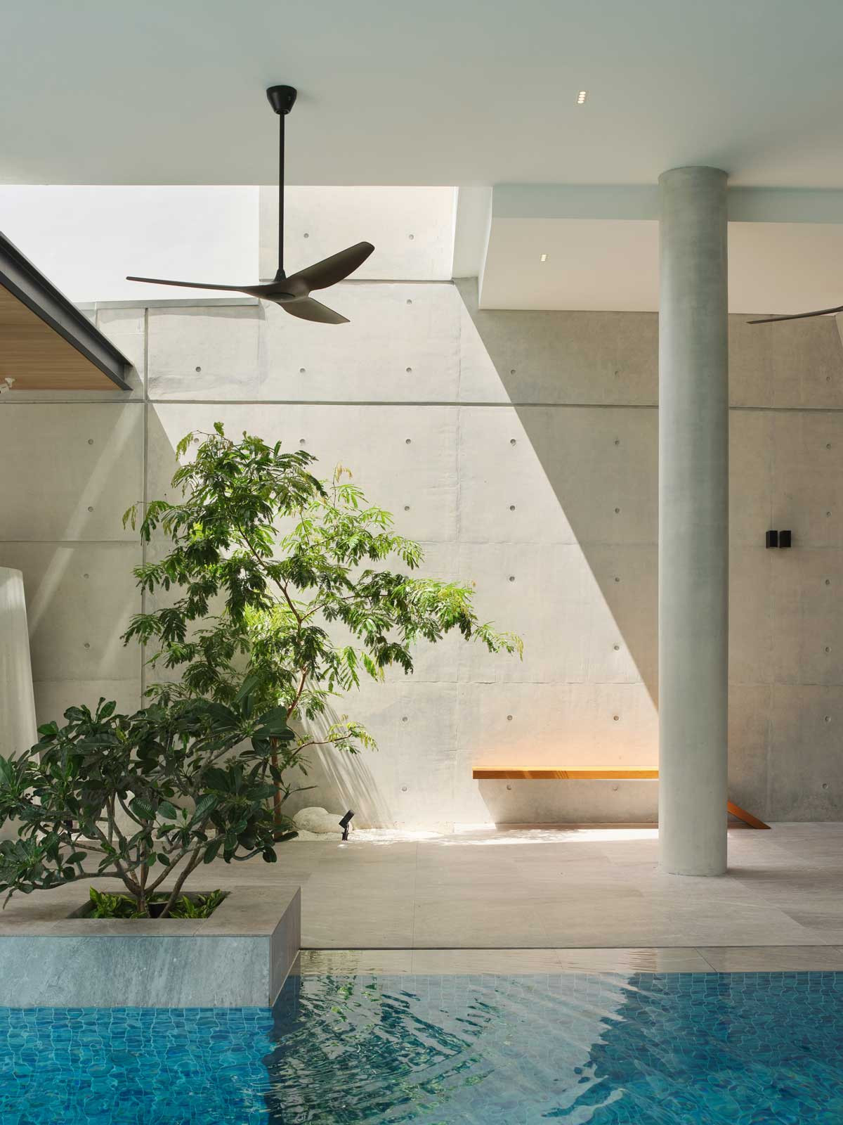 Strategic architectural openings lend themselves to poetic shadow play, as seen here in the pool area