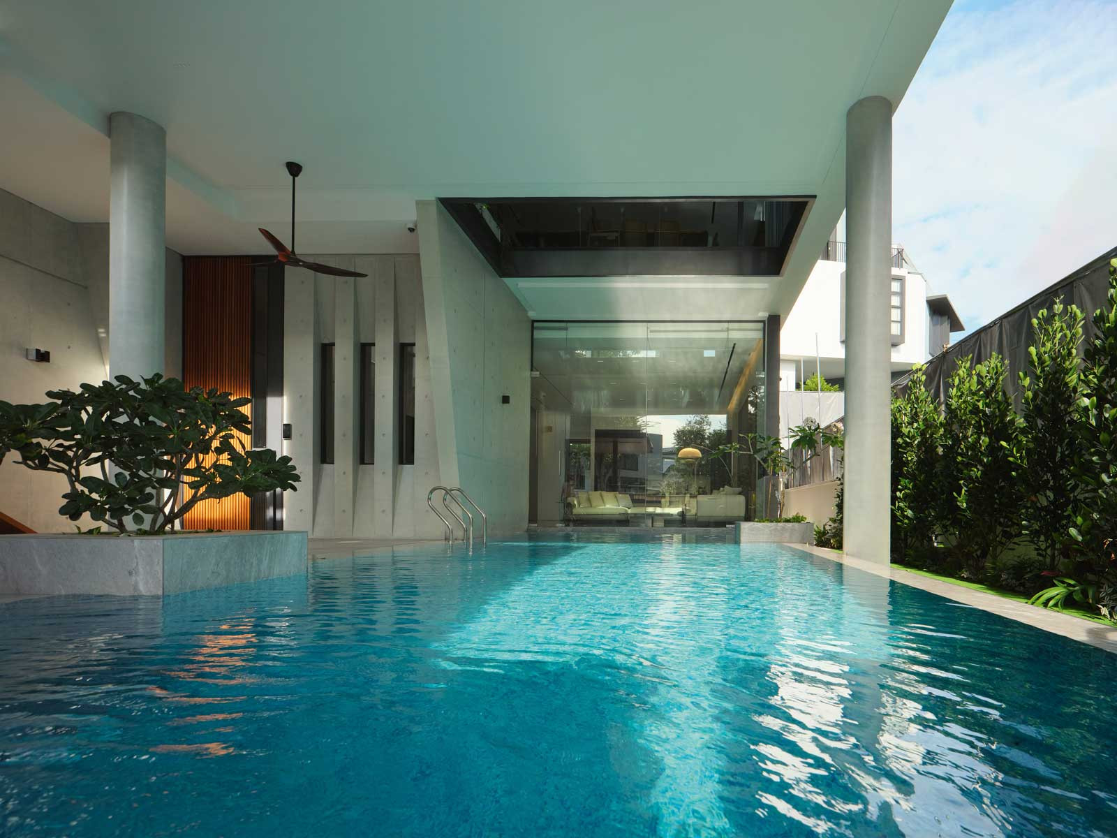 The living room offers views of the lap pool from the comfort of the indoors