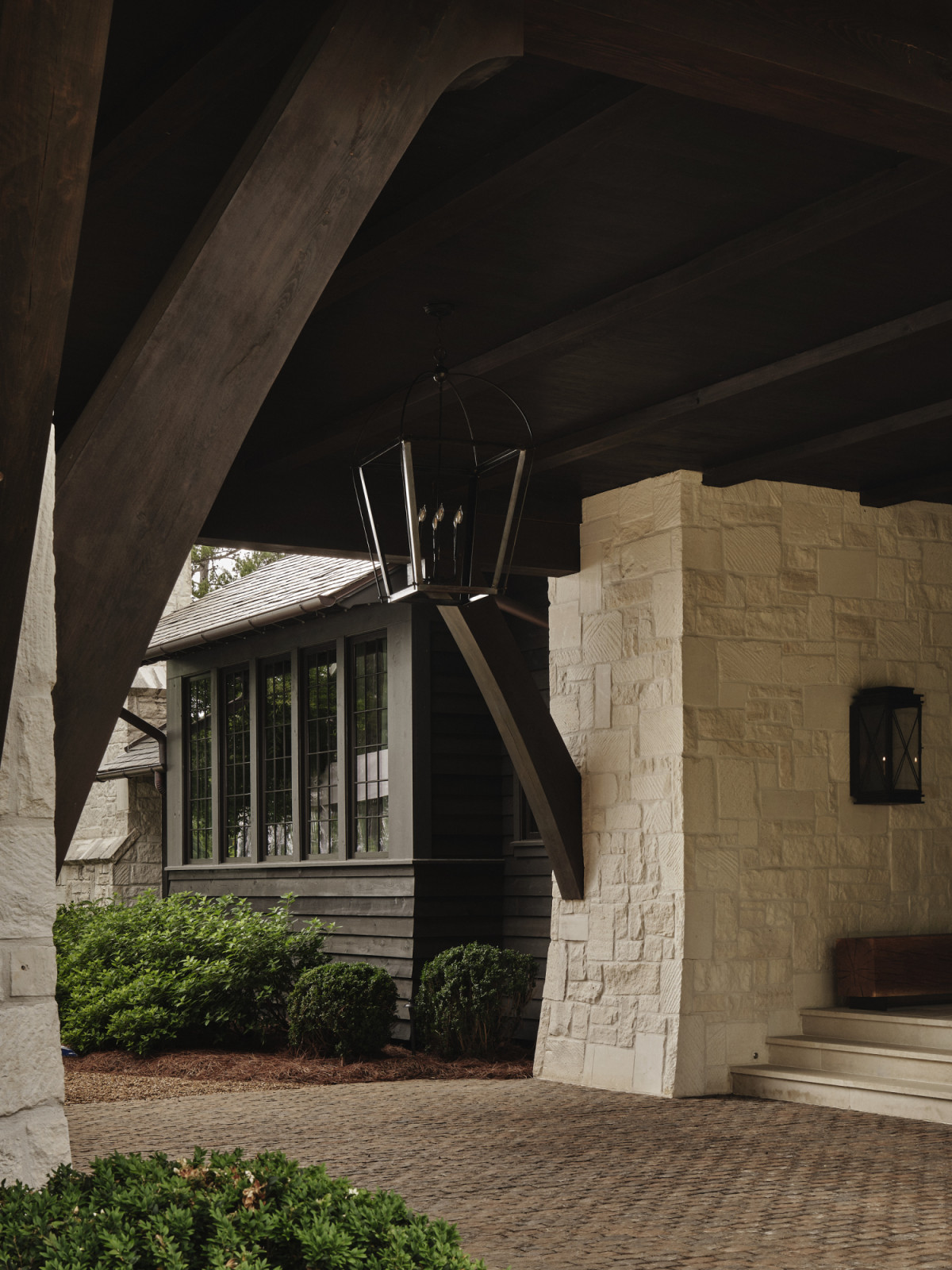 The porte-cochère pays a subtle homage to traditional forms