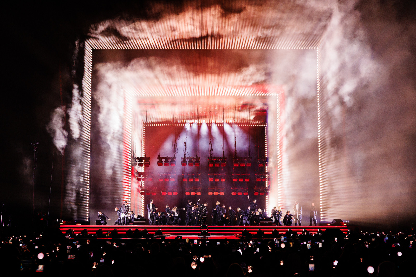BTS debuted ‘Swim’ amid blue-lit waves, RM powered through ankle injury for “FYA” hops, Suga mic-dropped “Mic Drop,” closing with emotional “Mikrokosmos” sea of purple lights (Photo: Bighit Music and Netflix @ 2026)