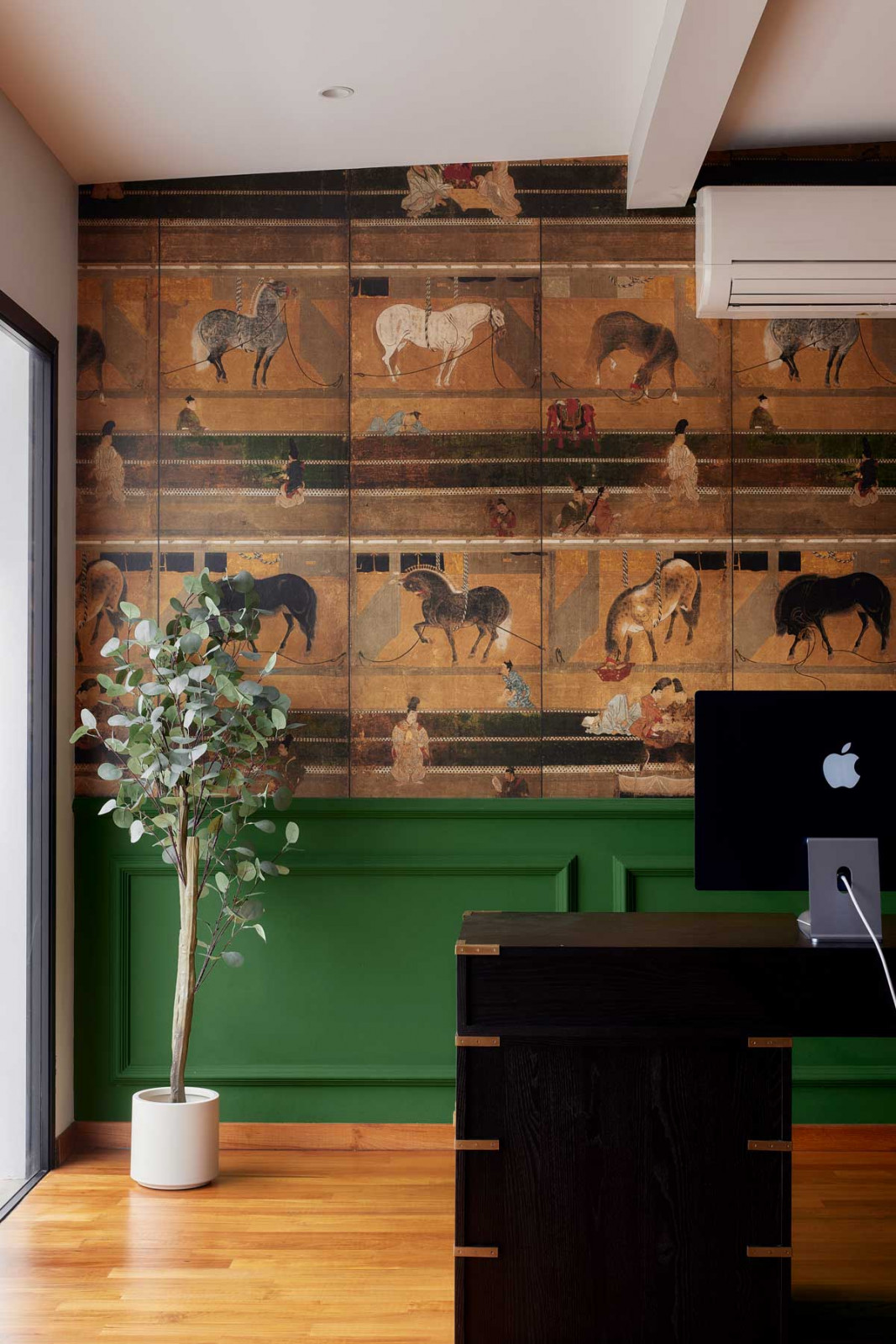 A richly printed wallpaper introduces colour, texture and playfulness