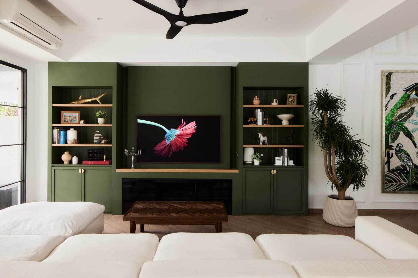 A striking green feature wall in the living area commands attention