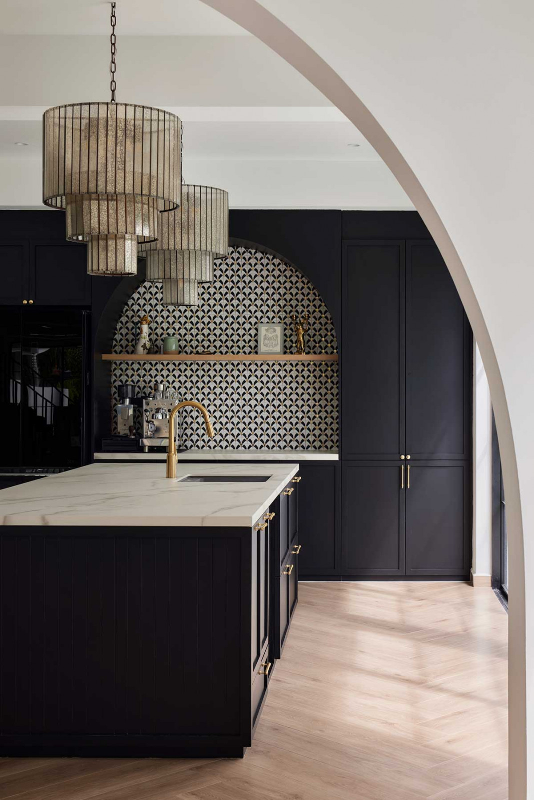 An arched opening frames the kitchen