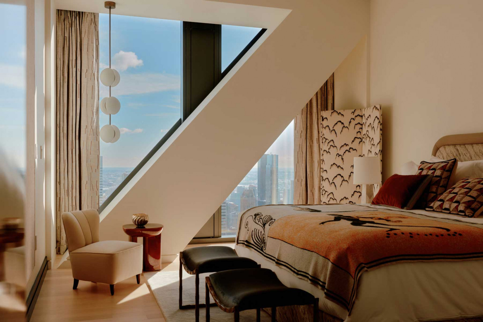 Another bedroom in the apartment, beautifully layered with vibrant textures and textiles
