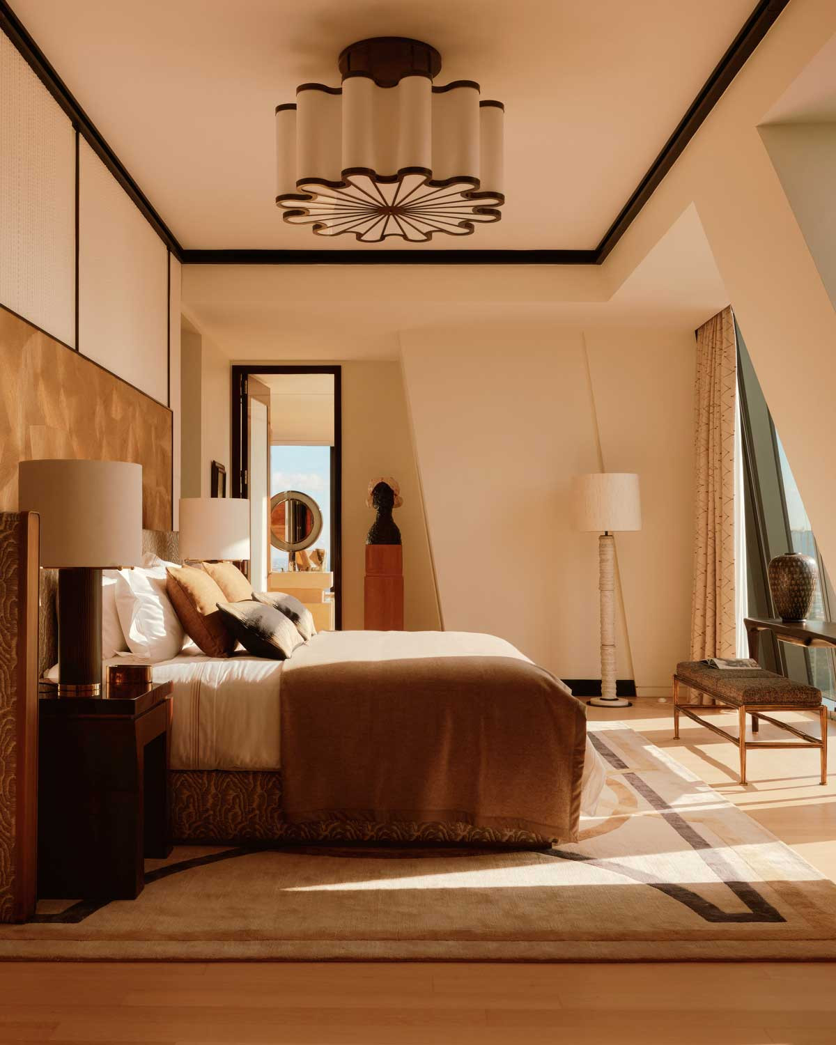 The primary suite was developed with Ateliers Tollis, where bespoke craftsmanship anchors the most intimate rooms of the residence