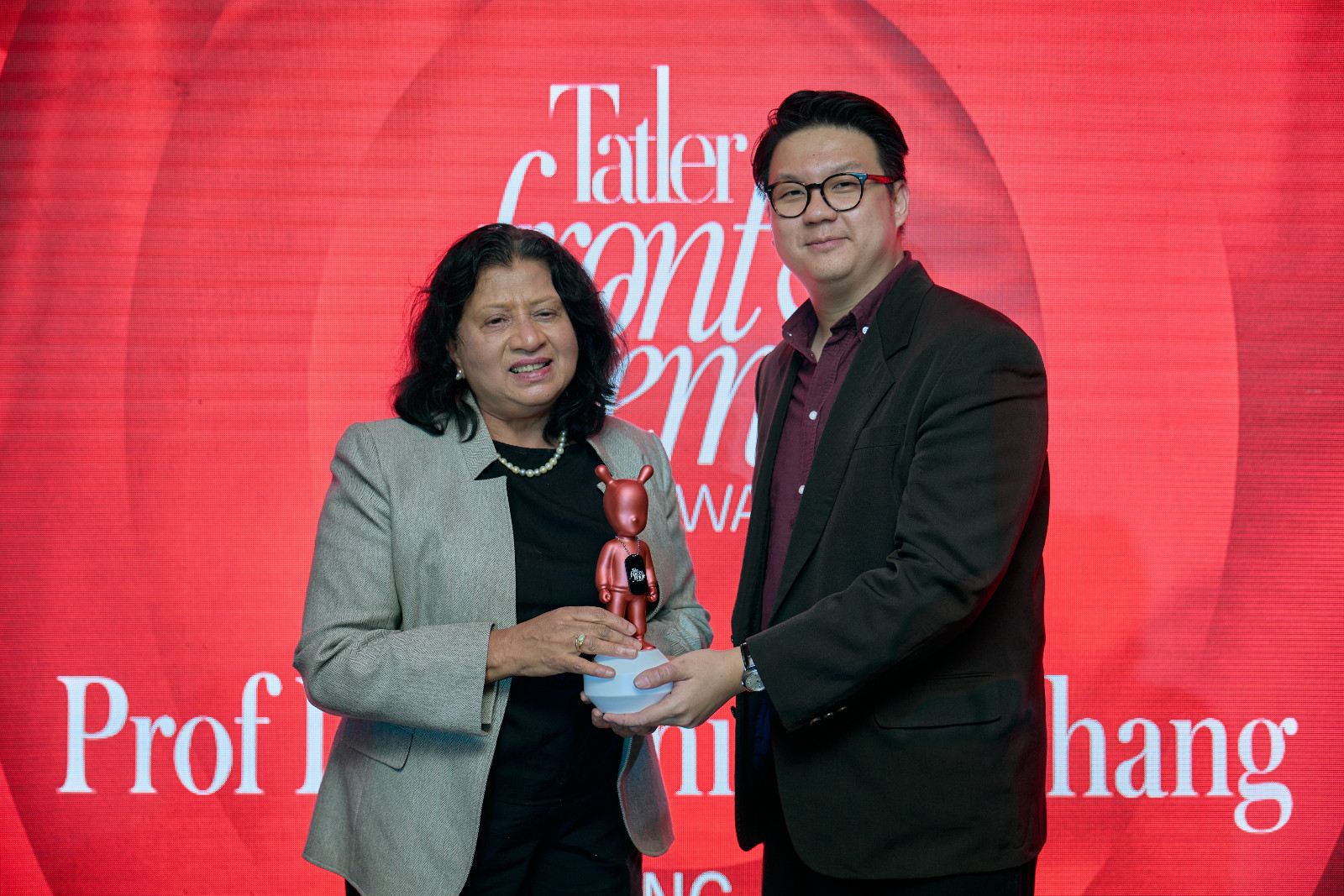 Wellbeing Award winner Prof Dr Sushila K Chang accepts her Lladró from Tatler Malaysia general manager, Sim Wie Boon