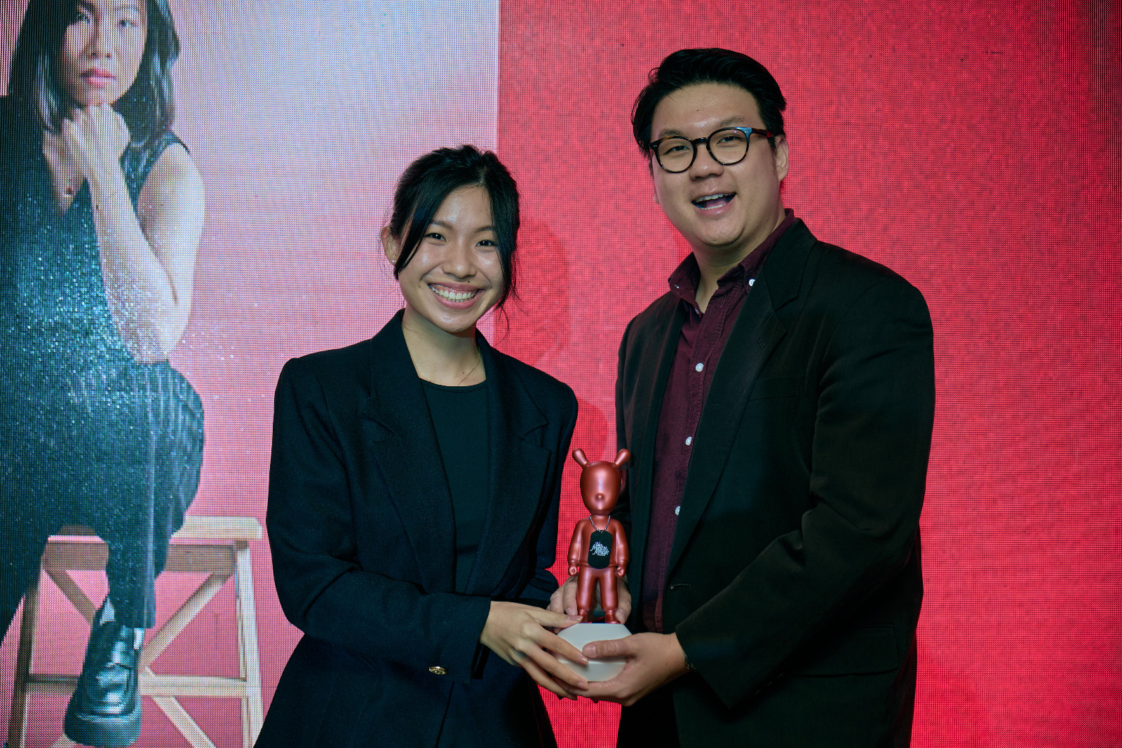 Innovation Award winner Natalie Loi accepts her Lladró from Tatler Malaysia general manager, Sim Wie Boon