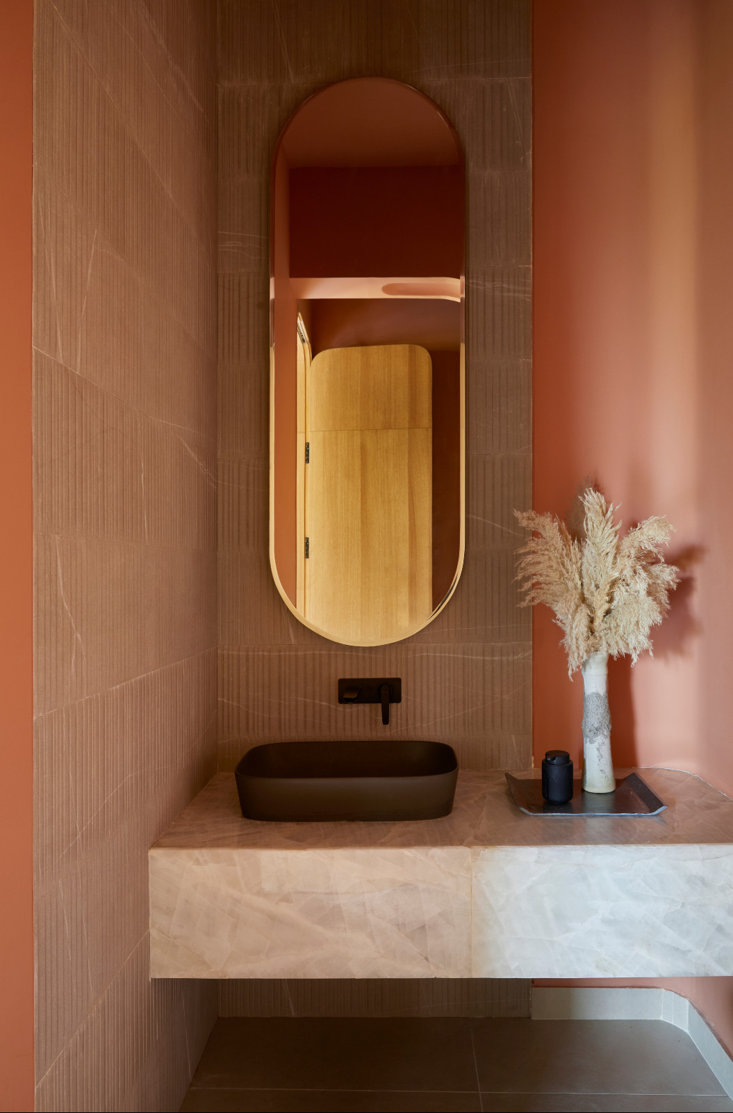 The powder room in a Hyderabad, India family home designed by Studio Nilasha