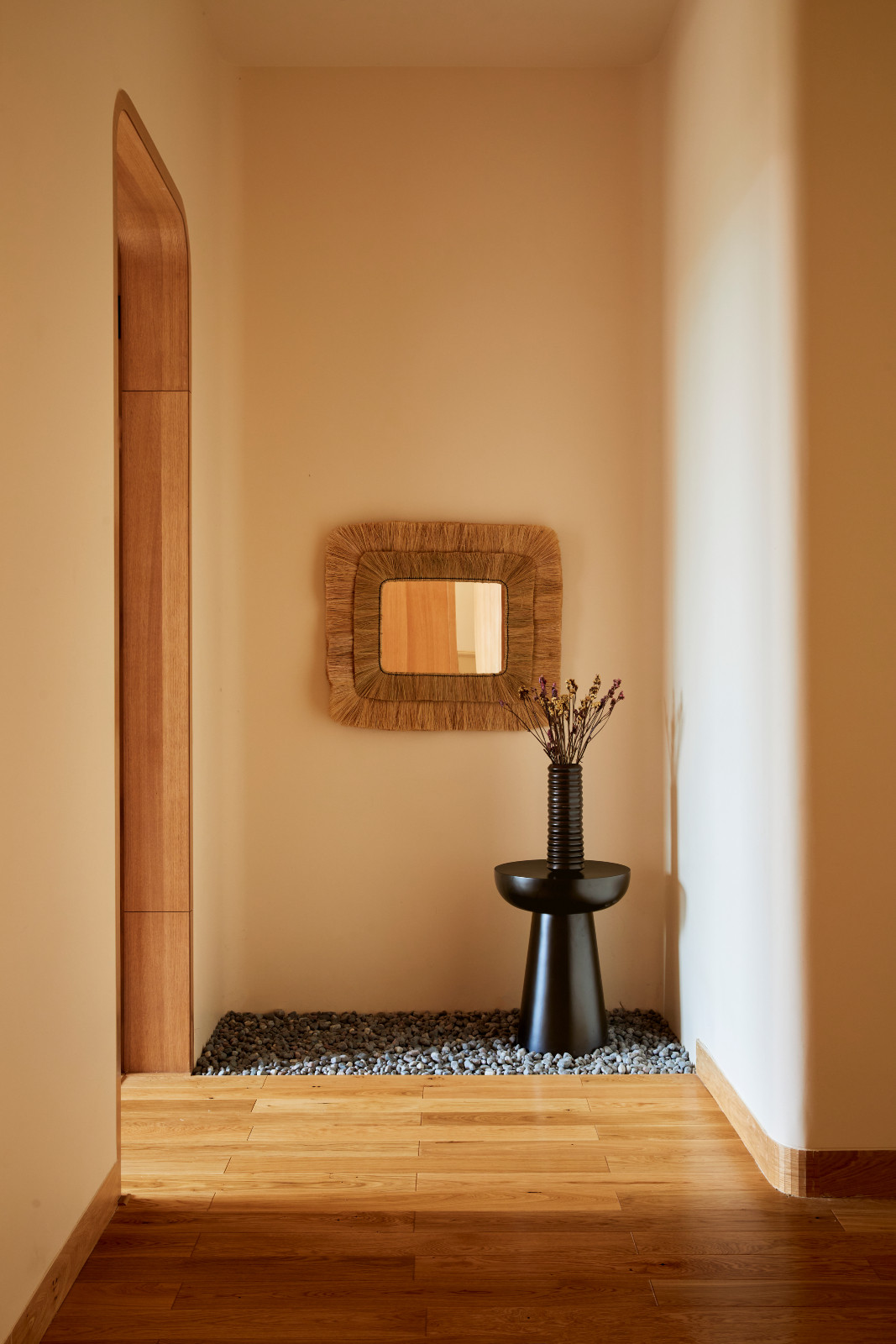 The tranquil hallway in a Hyderabad, India family home designed by Studio Nilasha