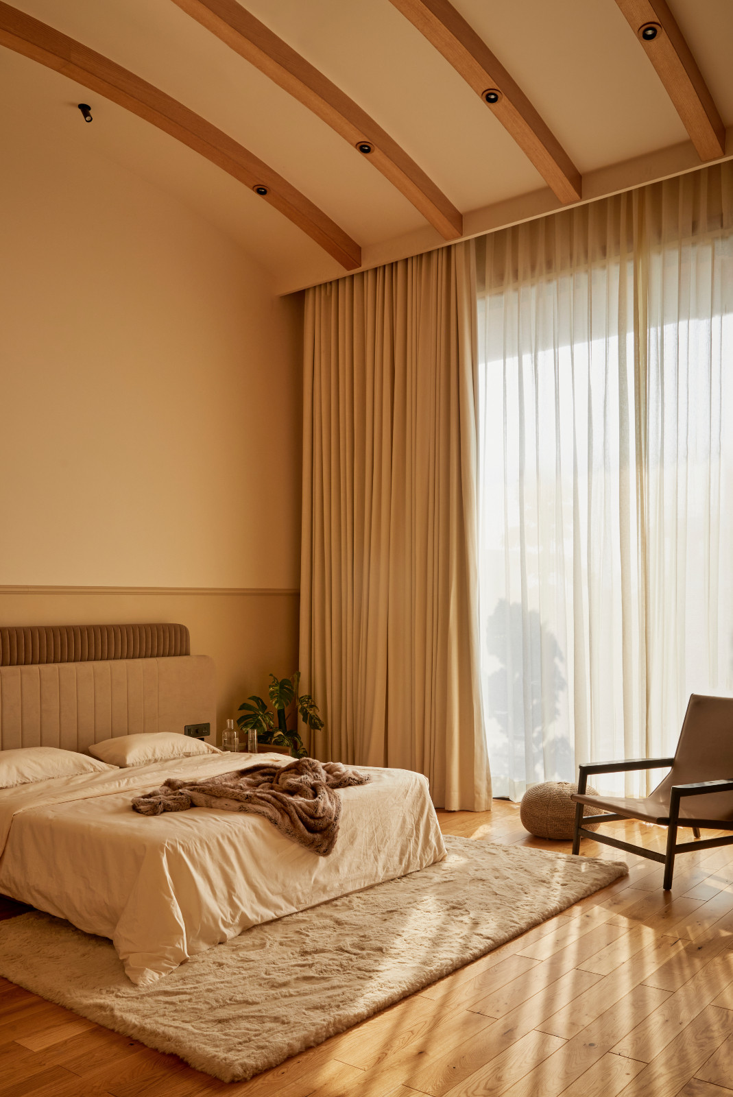 The primary bedroom in a Hyderabad, India family home designed by Studio Nilasha