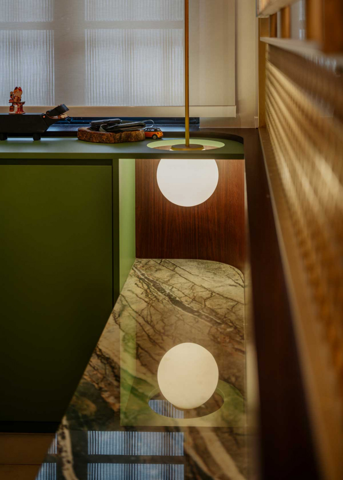 A pendant lamp gently illuminates the custom-built bench in the entrance foyer