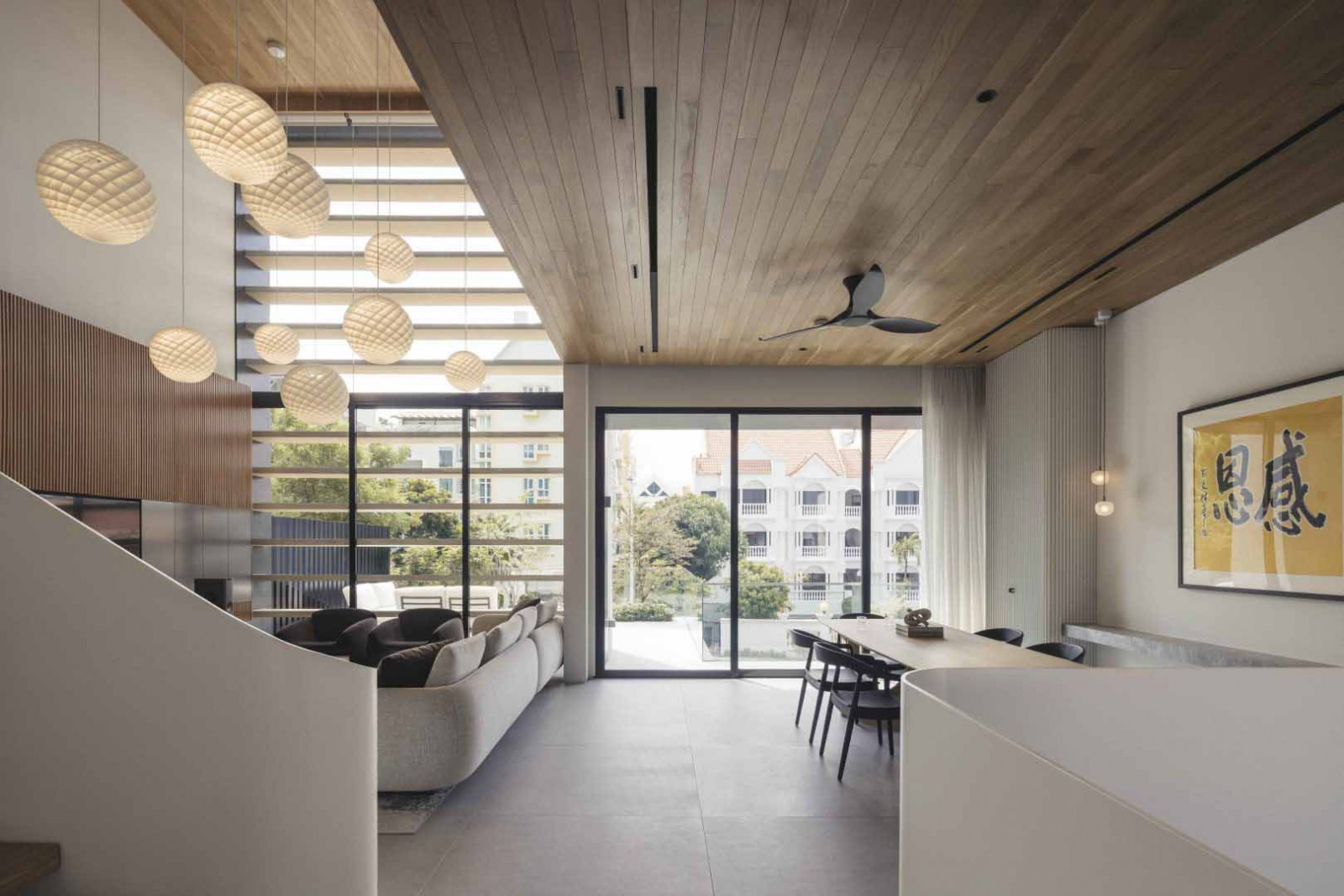 The semi-detached home’s living, dining and kitchen areas are placed on the second storey to optimise light and privacy