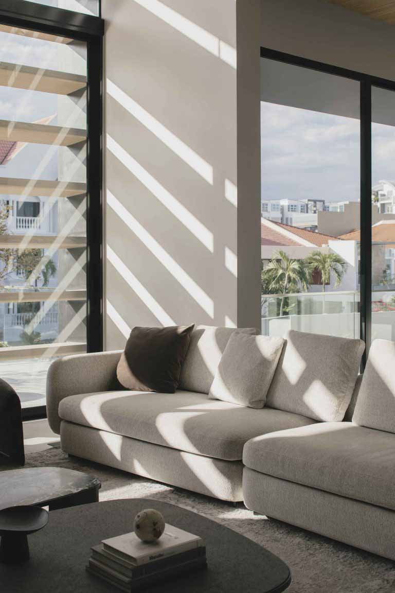 Sliding glass doors connect the living area to the outdoors while allowing