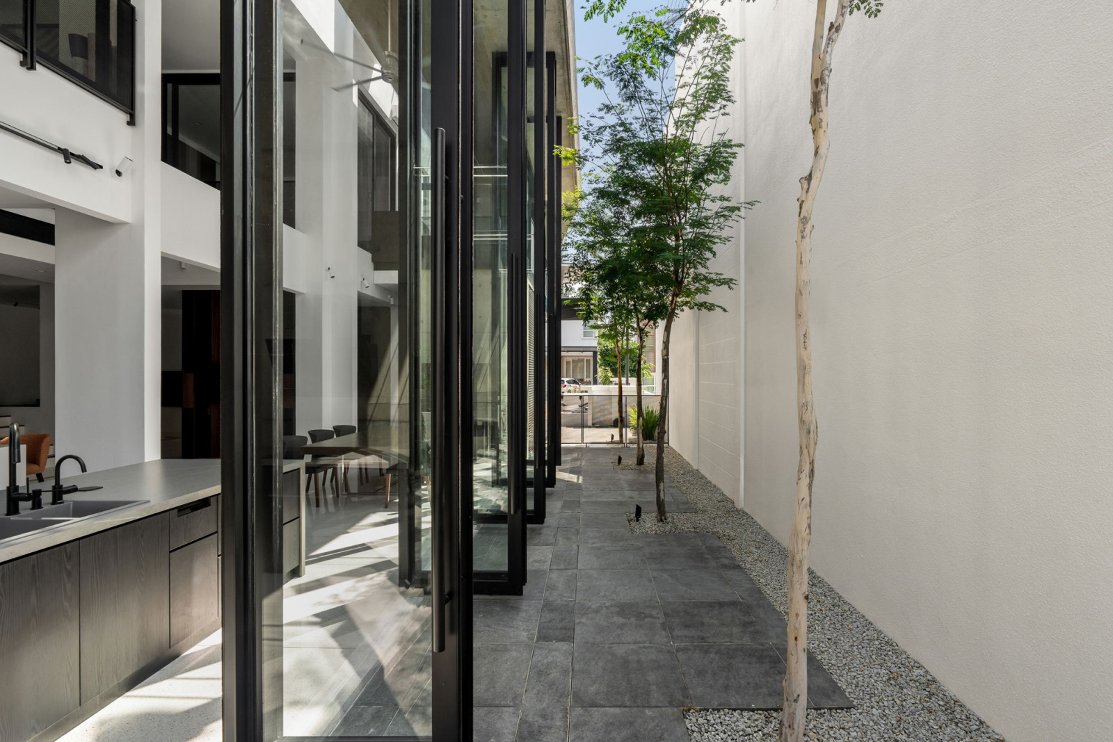 The garden side of the extension, with the pivoting glass panels open