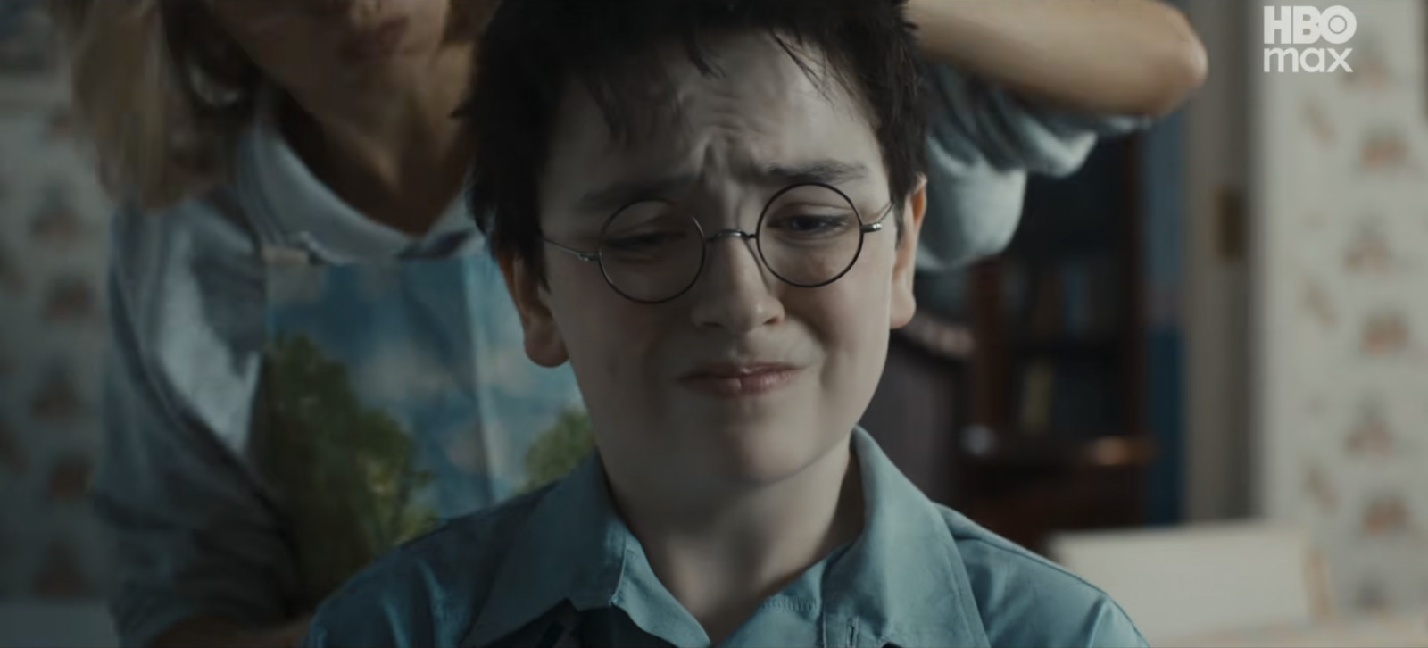 Aunt Petunia tries to tame Harry Potter’s famously stubborn hair (Photo: Screncap from YouTube)