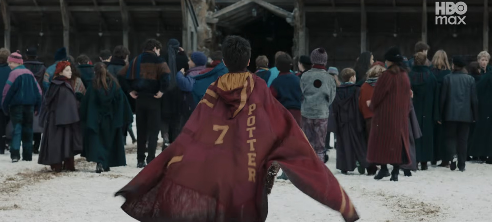 Harry sports his iconic Quidditch cloak (Photo: Screncap from YouTube)