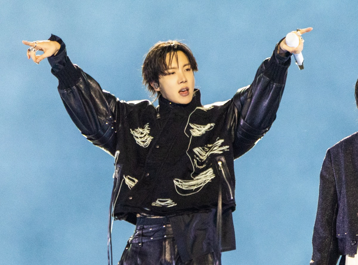 J-Hope pairs BTS choreography with Seoul skyline blueprints, stacking cash-bought pads in the city's hottest districts (Photo: Bighit Music and Netflix @ 2026)
