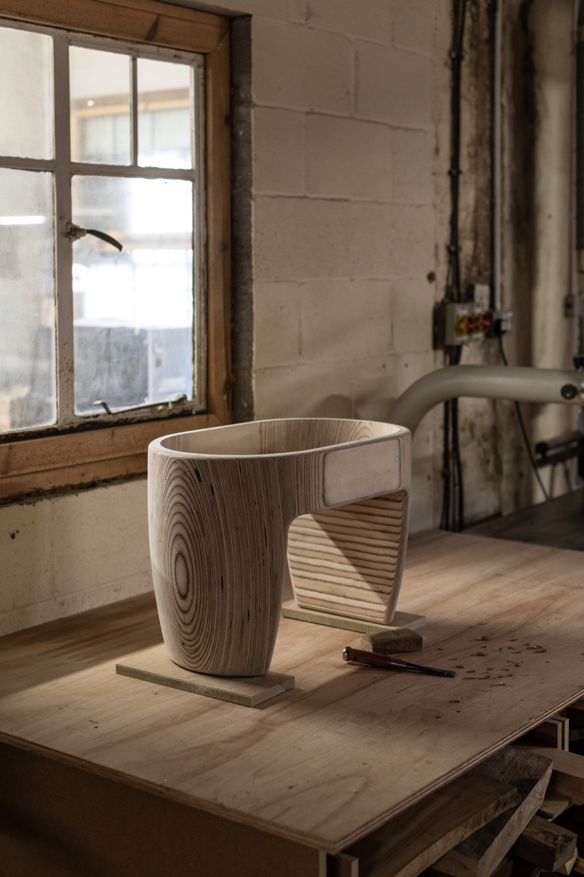 A birchwood leg component takes shape on a workbench at the Edelweiss workshop, Cambridge