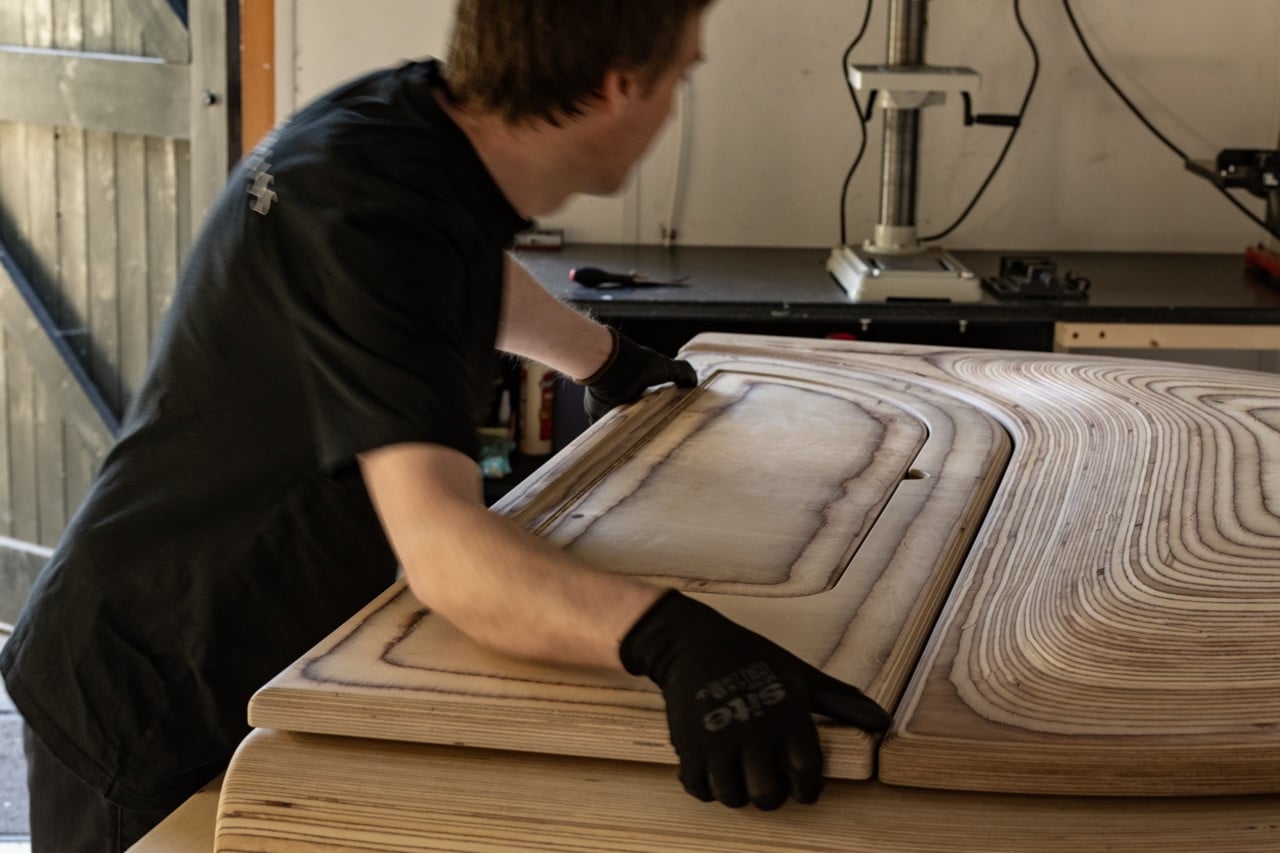 Surface finishing on the Timbra lid at the Edelweiss Cambridge workshop