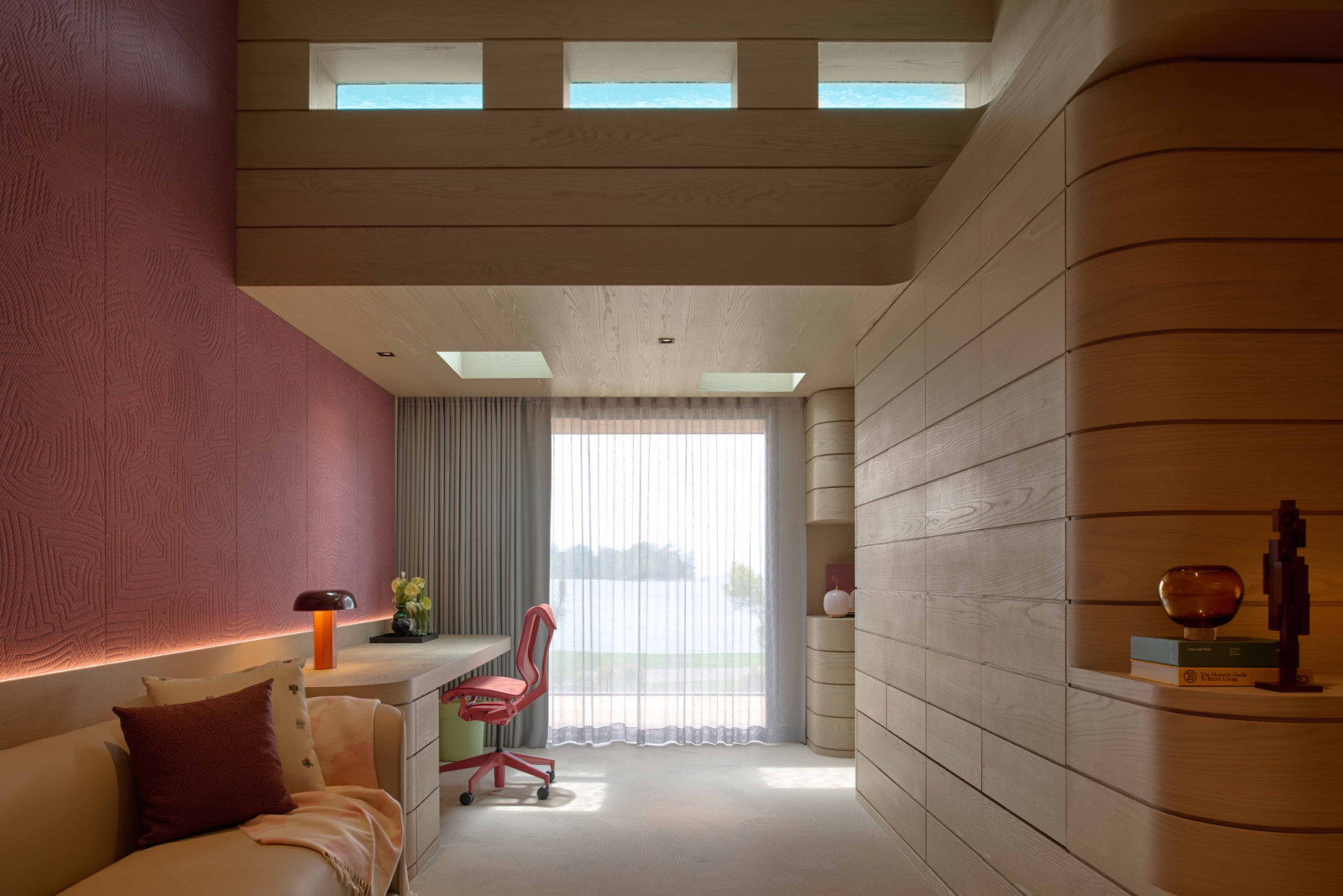 In the daughter’s bedroom clerestory openingc to the pool casts dancing reflections across the space