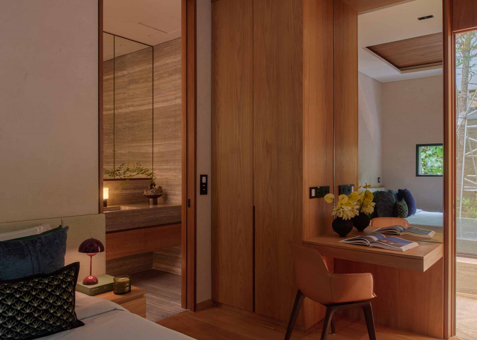 The Sentosa Cove bungalow’s guest bedroom includes a study area and an ensuite bathroom