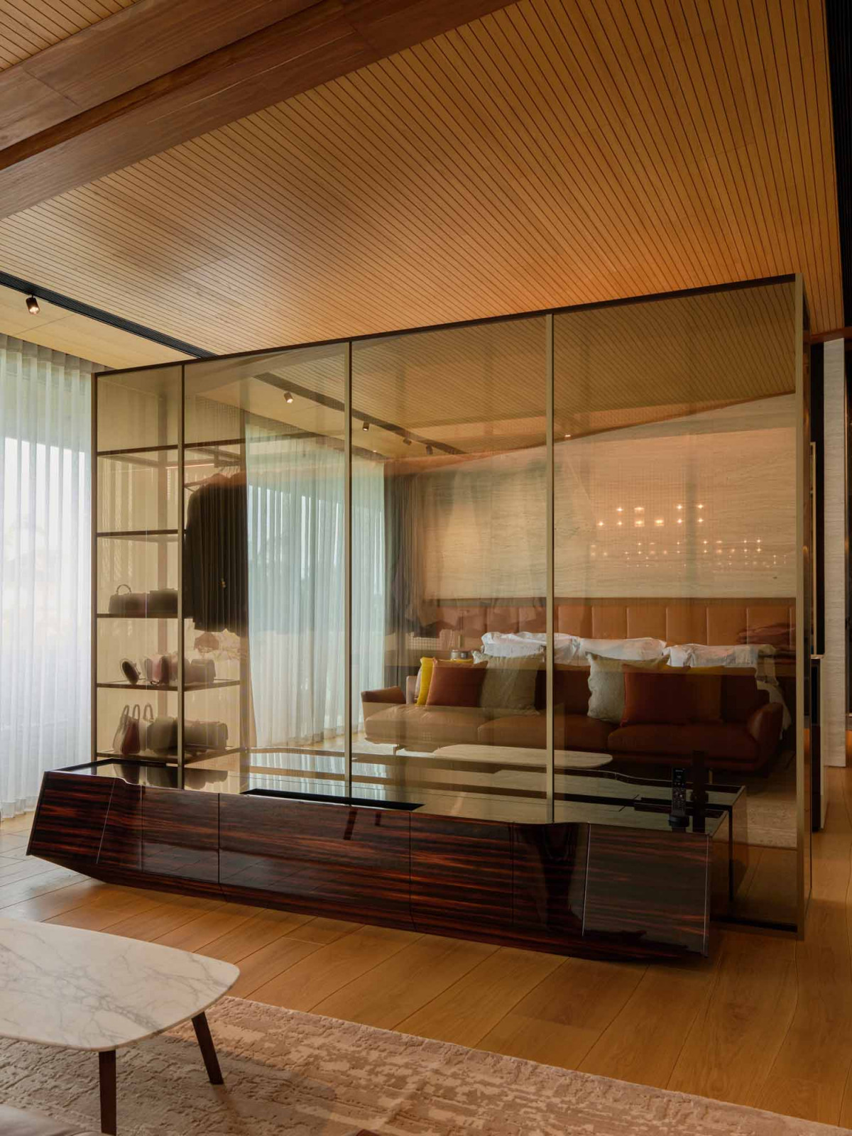 The master bedroom console conceals a retractable screen for movie nights