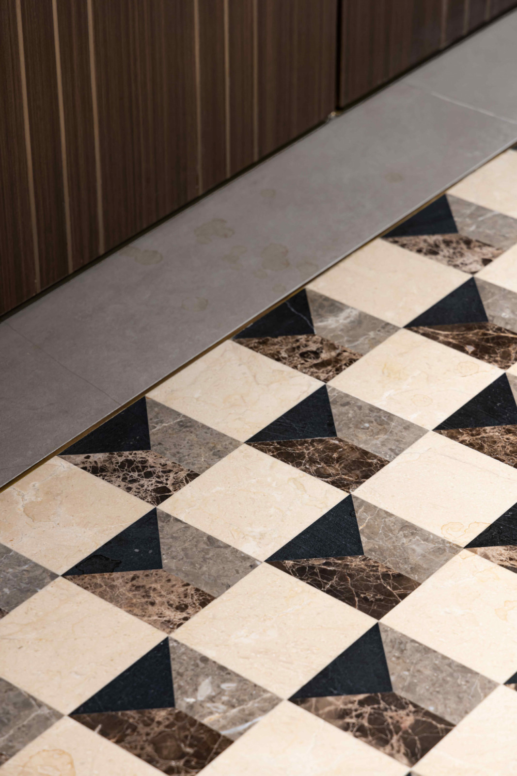Patterned marble flooring introduces a sense of refinement