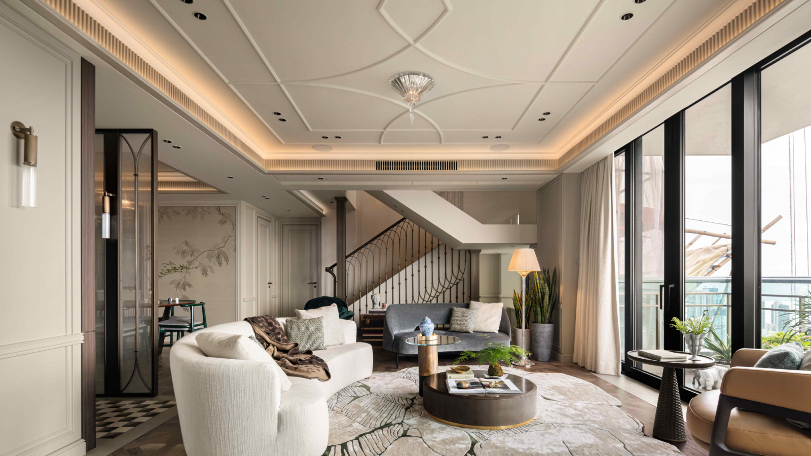 Delicate ceiling mouldings add layered richness of French architectural traditions
