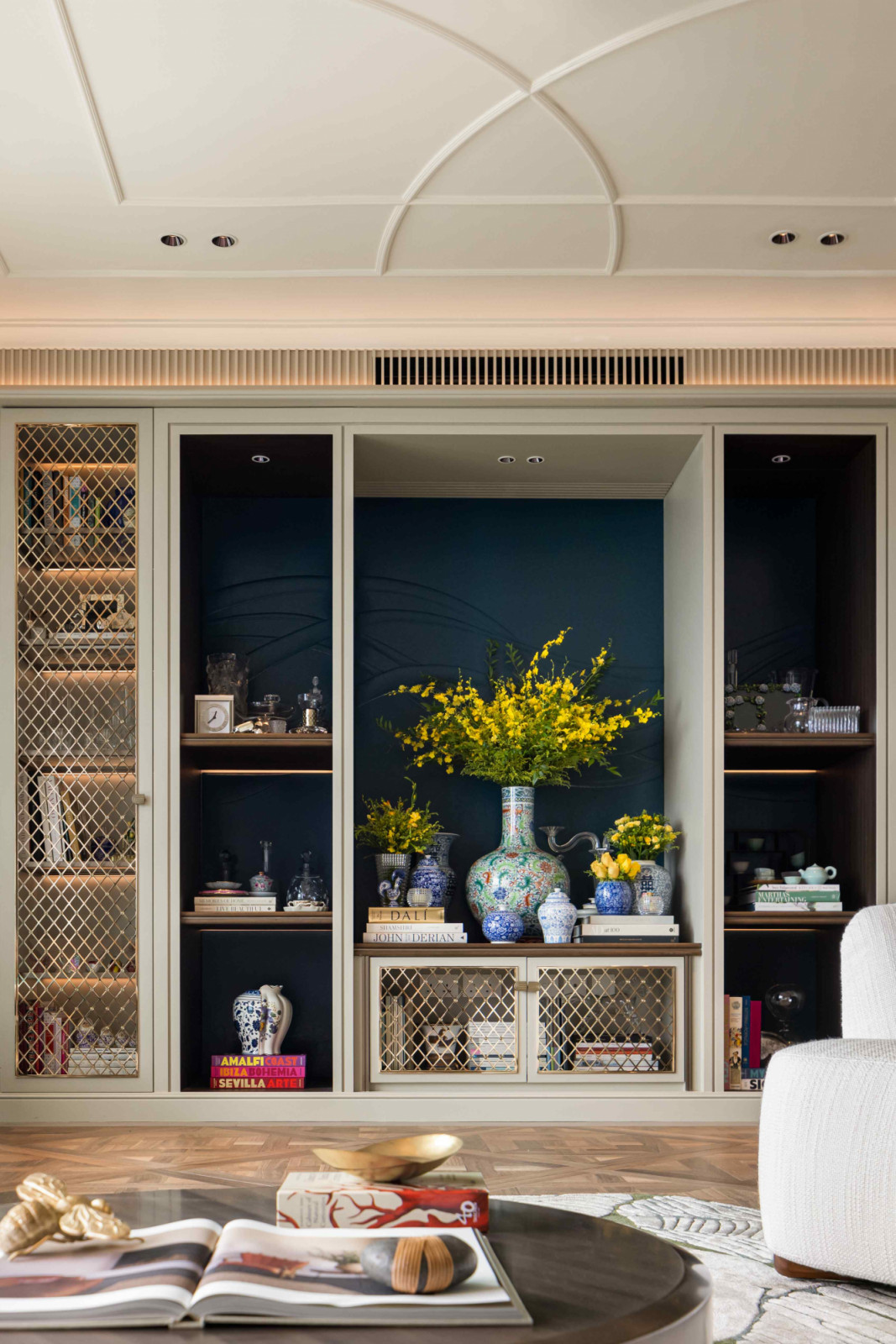 A bespoke embroidered leather feature wall in dark turquoise