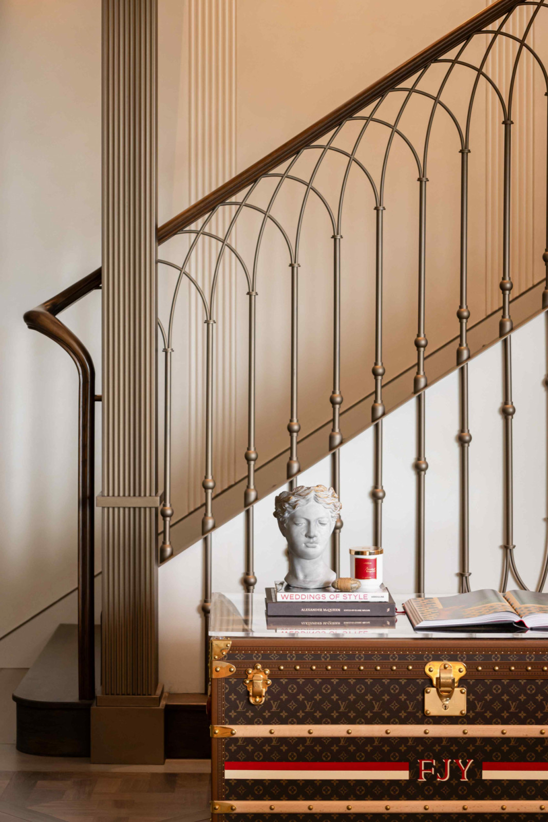 Intricate diamond balustrades line the staircase