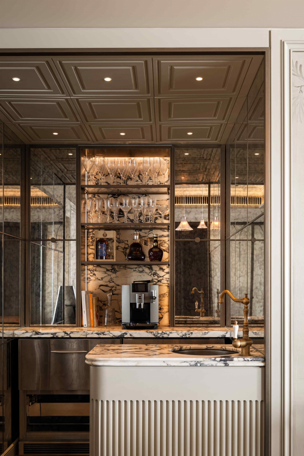 Marble countertop and backsplash command the kitchenette
