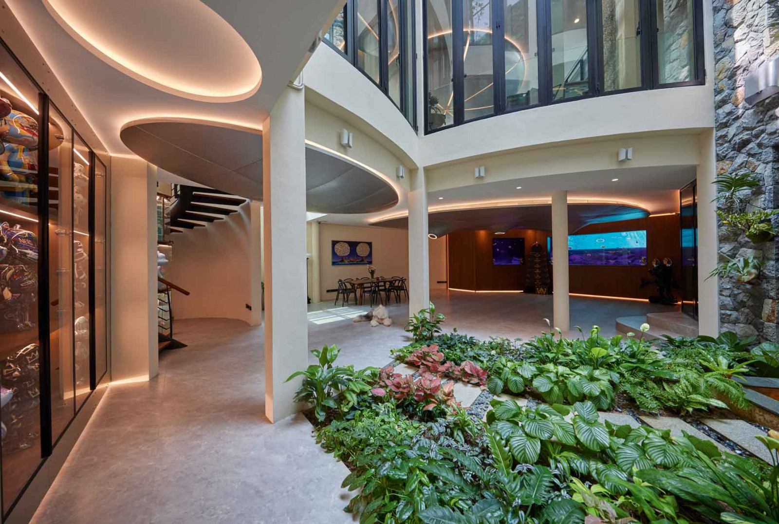 The spacious basement level is brightened by natural light entering from the planted courtyard