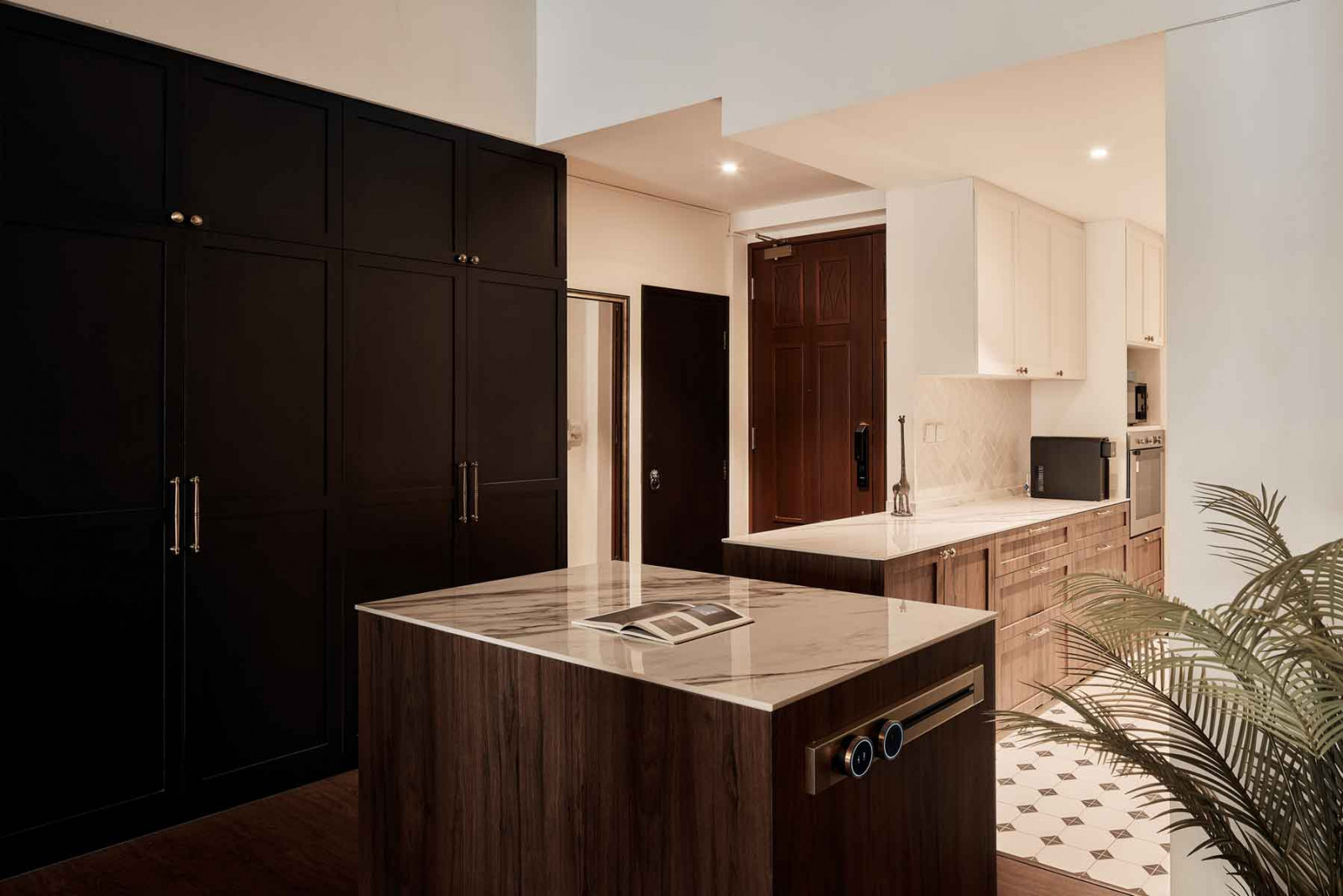 Sleek Shaker-style cabinets bring a classic allure
to the apartment