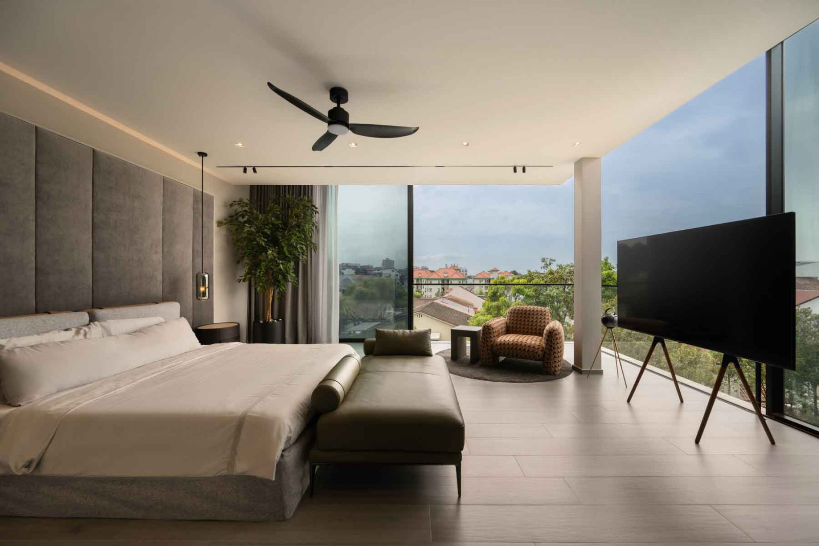 The glazed curtain wall of the bedroom opens fully to reveal an infinity view, seamlessly connecting indoors and out