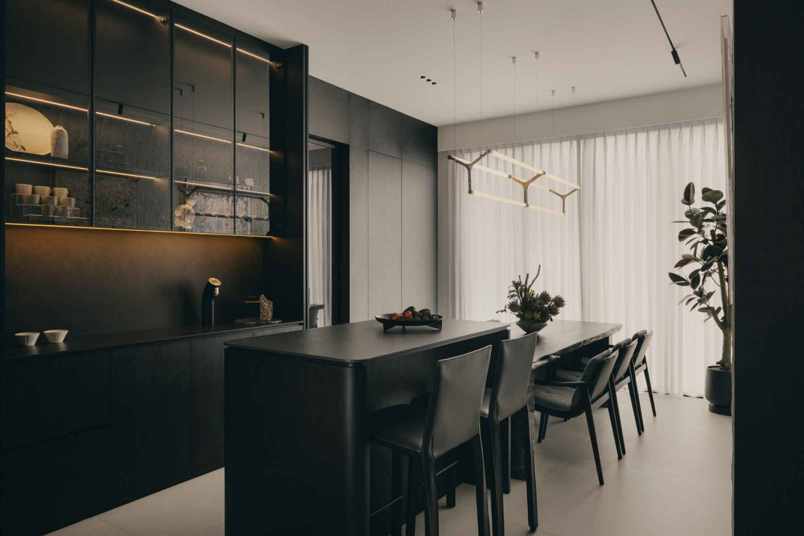 The reconfigured kitchen accommodates a bar-height breakfast counter and a dining area for six