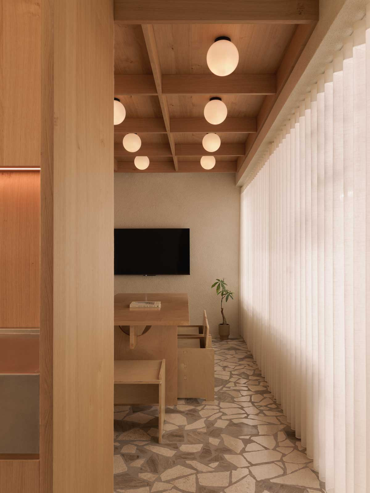 The Zen-influenced meeting room is a beautiful showcase for earthy shades, natural materials and clean lines