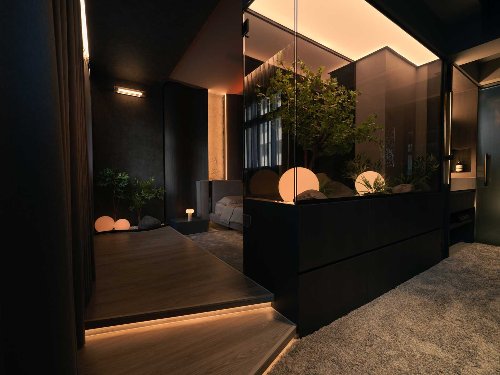 A sunken Zen garden enclosed in glass anchors the bedroom zone—bringing a meditative, biophilic presence into the private quarters