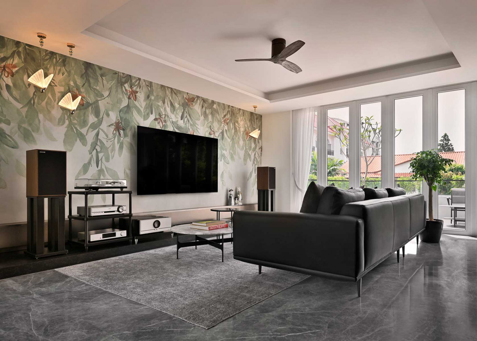 Foliage pattern on the wall is not wallpaper but large-format tiles from Hafary, selected for their biophilic appearance and ease of maintenance