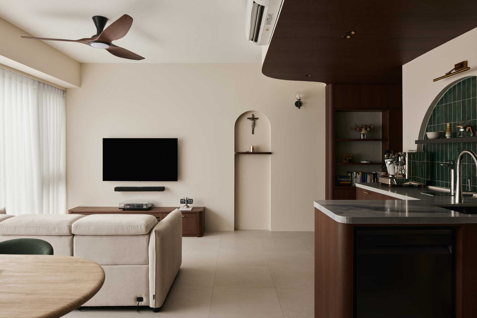 Intheory Design sets the tone for tranquillity with a curved timber ceiling, alcove altar and a calming palette that anchors this serene open-plan home