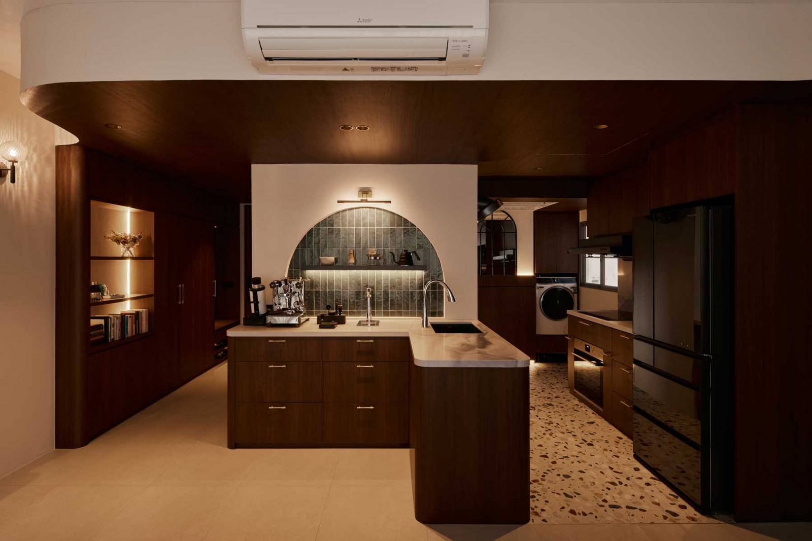 In the heart of the home, the arched green-tiled backsplash creates a striking focal point—adding depth, tactility and a subtle rhythm to the kitchen