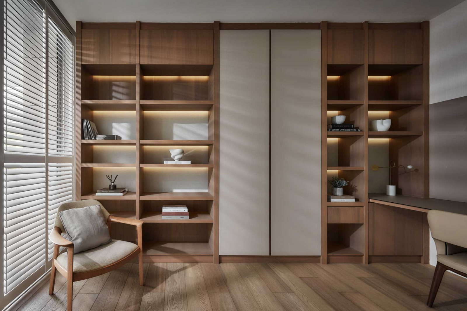 The material palette of the study exudes warmth and simplicity