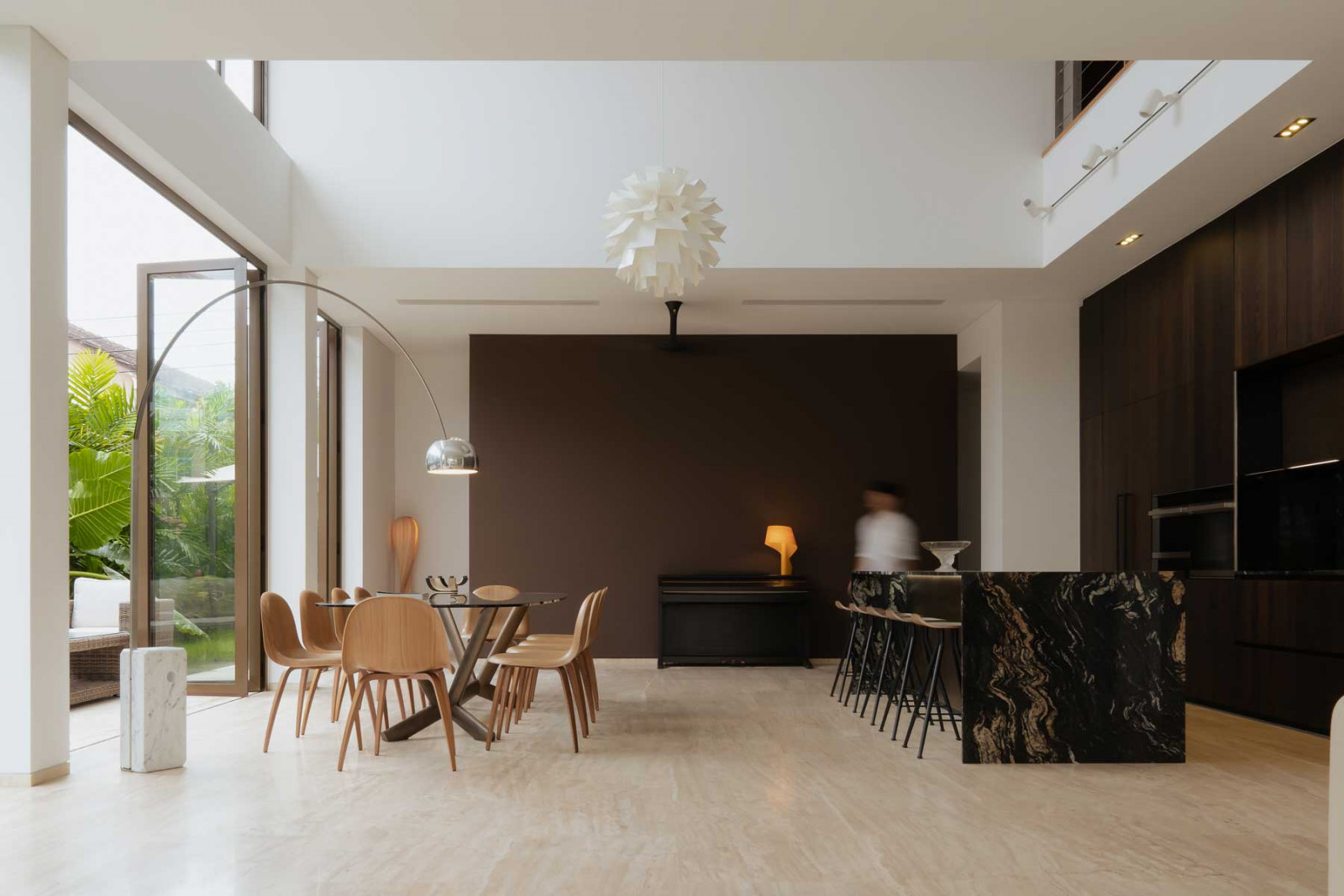 The double-volume ceiling lends drama to the dining space